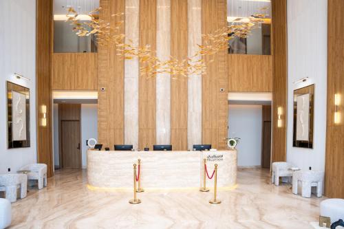 a lobby with a reception desk in a building at فندق ارجان بارك طويق 2 in Riyadh