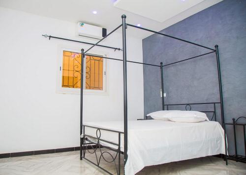 Llit o llits en una habitació de MARONE Villa