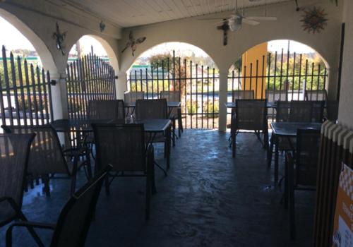 an empty restaurant with tables and chairs in a room at Days Inn by Wyndham Lenoir City in Lenoir City