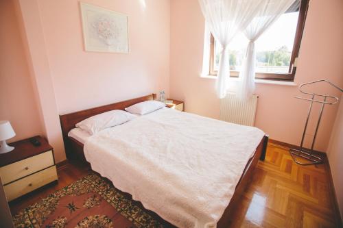 Ένα ή περισσότερα κρεβάτια σε δωμάτιο στο Hotel Zodiak