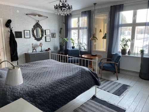 a bedroom with a bed and a table and chairs at Granbo station in Granbo