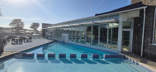 a swimming pool in front of a building at Caravan J&L Weymouth Bay in Weymouth