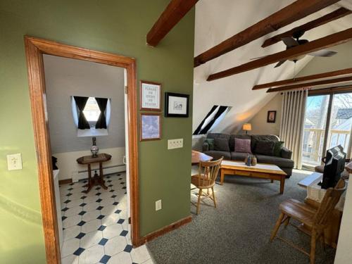 a living room with a couch and a table at Watership Inn in Provincetown