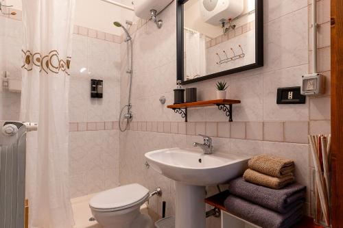 a bathroom with a sink and a toilet and a shower at Bed and Breakfast L'Annunziata in Sulmona