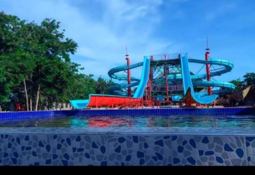 a water park with a roller coaster at Across The Nile Resort Jinja in Njeru