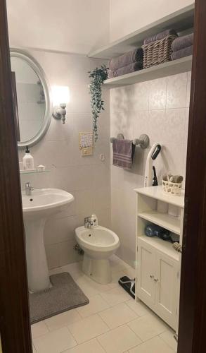 a bathroom with a sink and a toilet at Erika in Tarvisio