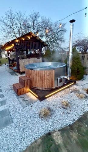 a hot tub with a gazebo in a park at Agroturystyka Gorajeckie Roztocze in Górajec Zastawie