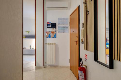 a hallway with a door and a fire hydrant at Perla del Salento in Brindisi