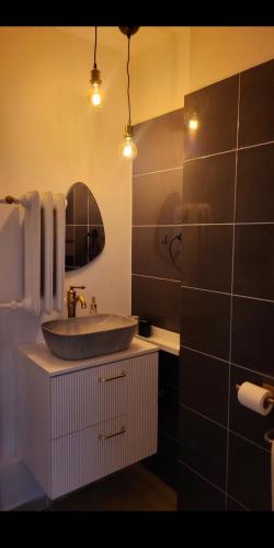 a bathroom with a sink and a mirror at Niebo in Lublin