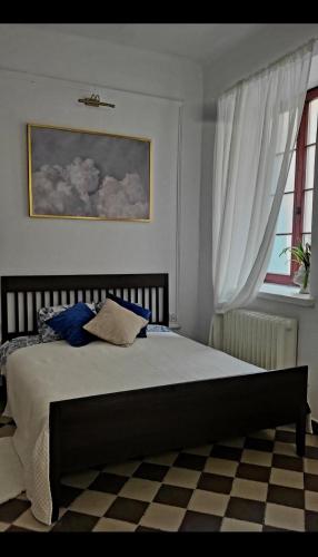 a bedroom with a bed and a window at Niebo in Lublin