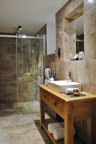 a bathroom with a sink and a shower at Rivington Barn in Kerne Bridge