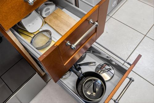 an overhead view of a drawer in a kitchen at 5 Star 30 Steps from Beach l 3m Walk to Rest & Shops in Clearwater Beach