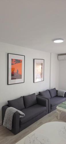 a living room with a couch and a table at Apartamento Marandel in Ronda