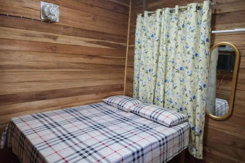 Llit o llits en una habitació de Greenhouse
