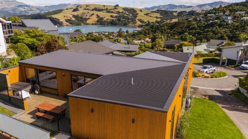 an overhead view of a house with a black roof at Renard Retreat in Akaroa