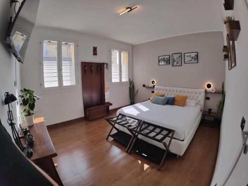 a room with a bed and a table in it at Chez Nous in Comacchio