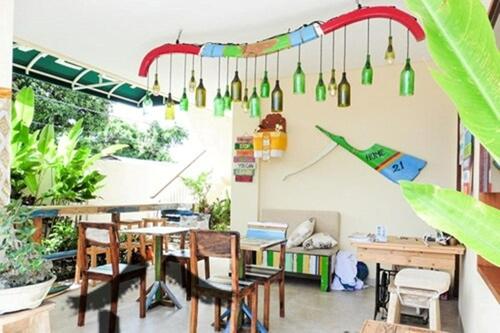 a room with a table and chairs and a bunch of lights at Home 21 Bali in Sanur