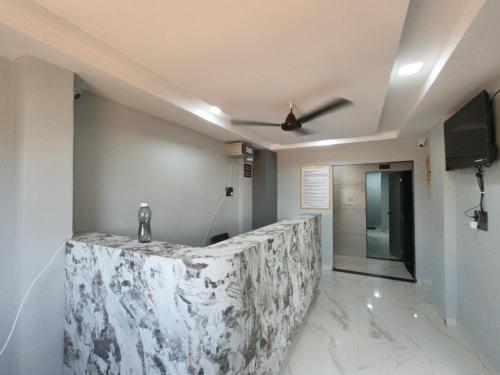 a corridor of a room with a ceiling at Hotel Rudra in Wākal