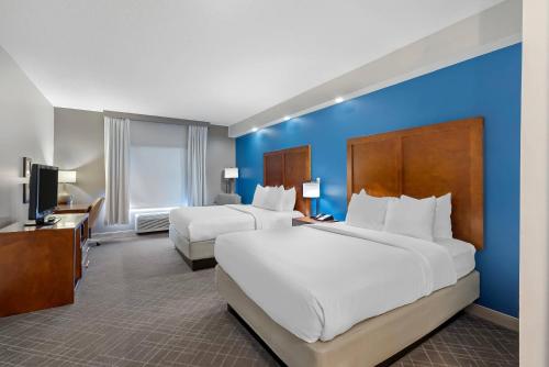 a hotel room with two beds and a tv at Comfort Inn West Monroe near Sports & Events Center in West Monroe