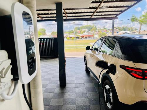 a car is parked in a car dealership at SingLeisure Holiday House in Mersing