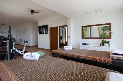 a bedroom with two beds and a mirror at Luxury Sea View Jungle Beach Villa Walk to Beach in Ban Bang Po