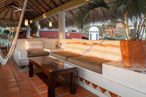 a living room with a couch and a coffee table at Hidden Gem! Charming 2 Bedroom Vacation Home! in Puerto Escondido