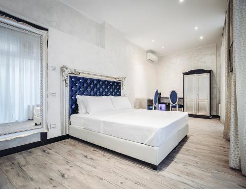 Ένα ή περισσότερα κρεβάτια σε δωμάτιο στο Arena Easy Suites Guesthouse