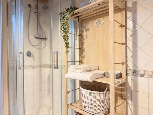 a towel rack in a bathroom with a shower at Charming Studio with Brick Vaulted Ceilings in Perugia