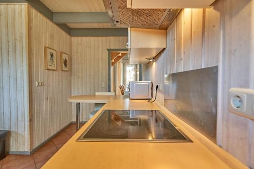 a kitchen with a table and a sink in it at Wildgans Classic 248 in Mirow