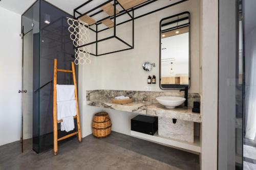 a bathroom with a sink and a mirror at K Studios in Faliraki