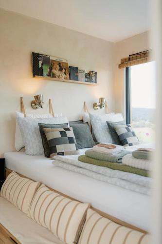 a bedroom with two beds and a window at KOOLNA pod kopcem in Valašské Meziříčí