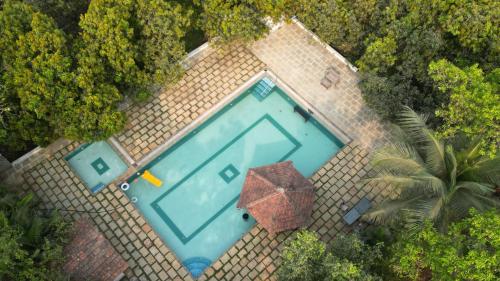 an overhead view of a swimming pool on a roof at The Rising Sun Farm Karjat - Luxury Stays - Couple Friendly in Karjat