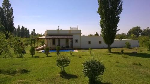 a house in the middle of a field at Finca La Penúltima-Posada in San Rafael