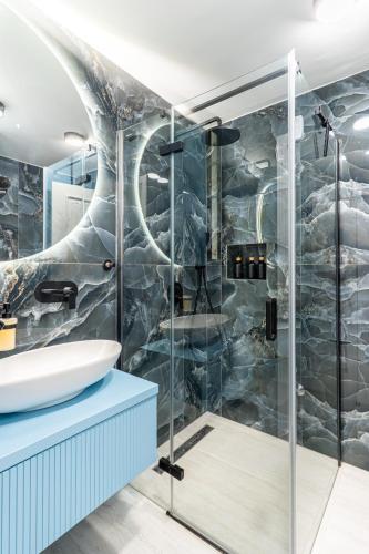 a bathroom with a shower and a sink at Vila Inar Cres in Cres