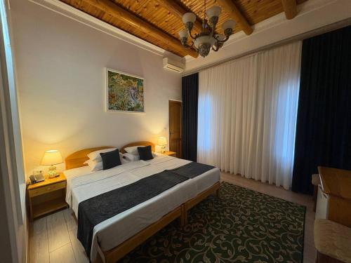 a bedroom with a large bed in a room at Porso Boutique Hotel in Bukhara