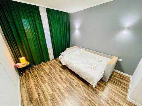 En eller flere senge i et værelse på Studio Room Chisinau