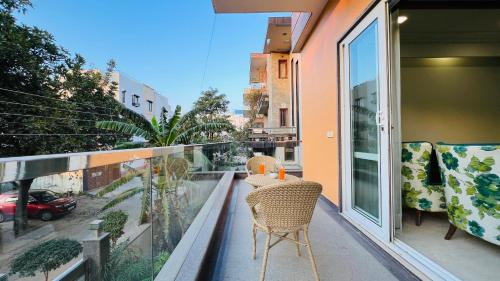 a balcony with two chairs and a table on it at BluO Medicity - Boutique Hotel Gurgaon in Gurgaon