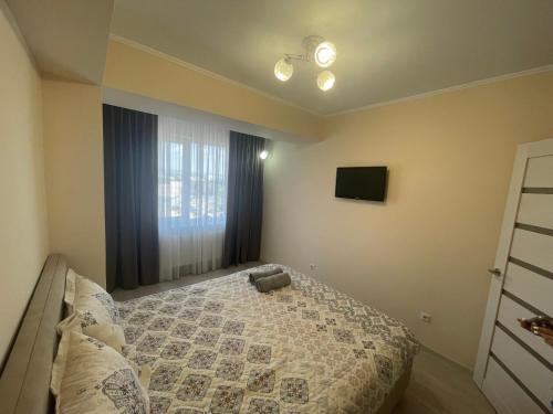 Llit o llits en una habitació de Hola apartment