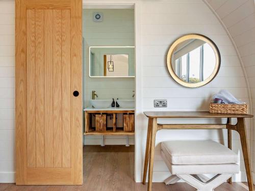 a bathroom with a sink and a mirror at 1 Bed in Tain oc-96065 in Nigg