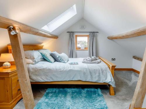 a bedroom with a bed and a window at 1 Bed in Gloucester oc-60276 in Tirley