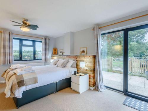 a bedroom with a bed and a large window at 2 Bed in Northwich oc-85877 in Kingsley