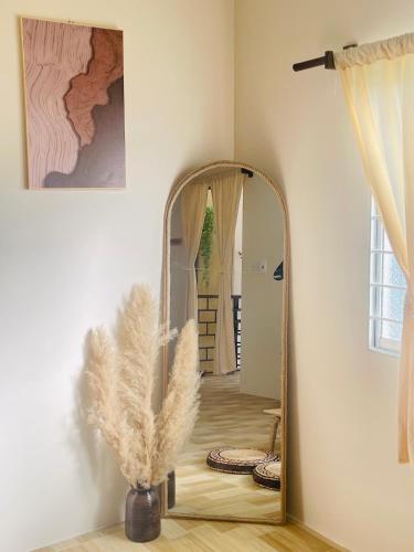 a large mirror in a room with a hallway at Homestay 234 Dốc Lết in Ba Ha