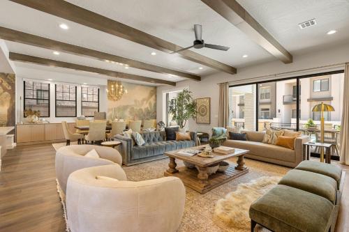 a living room with couches and a table at The Boardwalk home in St. George
