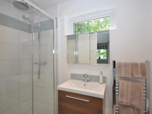a bathroom with a sink and a glass shower at 1 Bed in Banbury oc-57103 in Upper Brailes