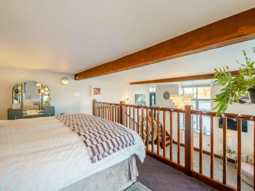 a bedroom with a bed and a balcony at 1 Bed in Carnforth oc-90528 in Beetham