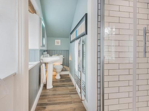 a bathroom with a sink and a toilet at 4 Bed in Broughton-in-furness oc-sz183 in Ulpha