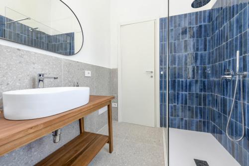 a bathroom with a sink and a shower at MGH - Villa Sirmione in Sirmione