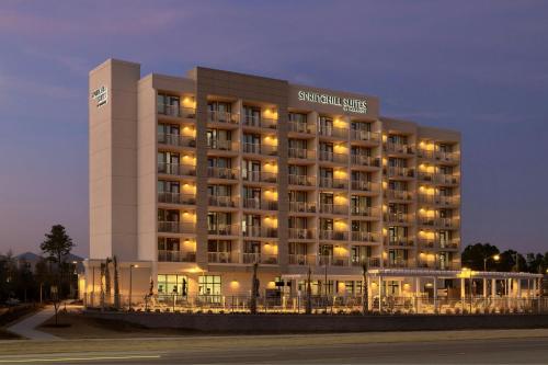 a hotel building with lights in the night at SpringHill Suites by Marriott Orange Beach Gulf Shores in Orange Beach
