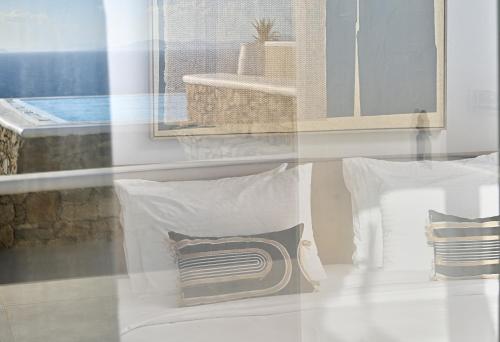a group of pillows sitting on a table at Margi Villas in Mikonos