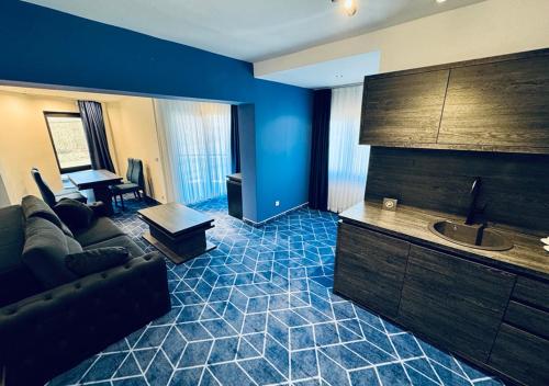 a living room with a couch and a table at Hotel Biga in Zavidovići